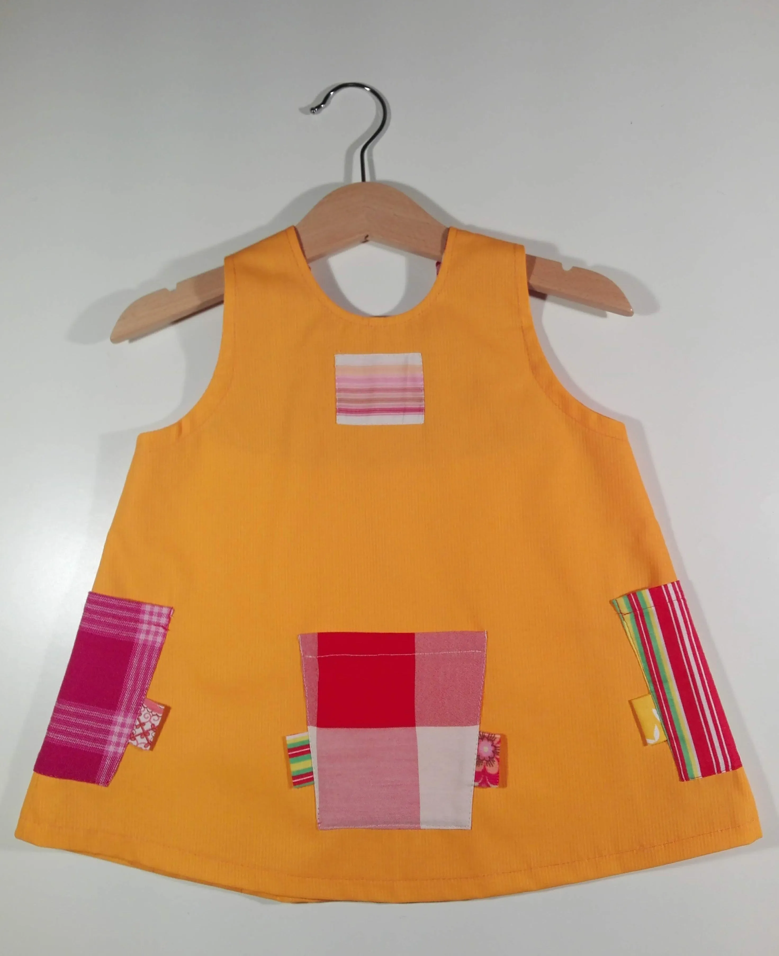 Trapeze Dress in cotton orange with colored patches